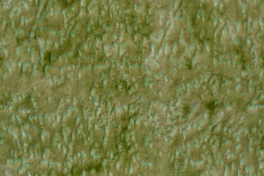 A seamless texture of synthetic green polyester soft furniture upholstery with random blots pattern