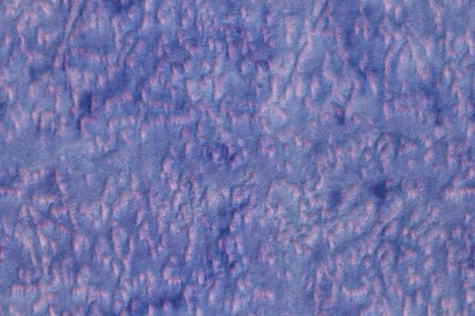 A seamless texture of synthetic purple polyester soft furniture upholstery with random blots pattern