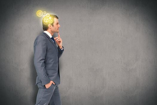 Thinking businessman against white and grey background