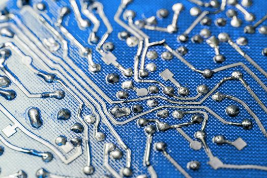 back side of old flat bare fiberglass pcb without components with selective focus