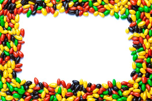 Hundreds of small gloss glazed sunflower seeds multicolor flat round mockup frame with selective focus. Central area isolated on white backgroud.
