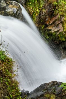 Beautiful veil cascading waterfalls, mossy rocks 