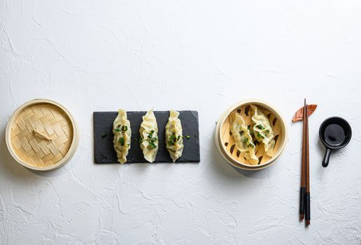 Chinese snacks. chinese steamed dumpling. Chinese Traditional cuisine concept. Dumplings Dim Sum in bamboo steamer with text copy space. Asian food on white background.