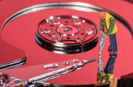 Small mining figurine illustrating concept of artificial intelligence or machine learning using deep data analytics