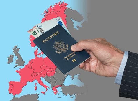 Senior man holding US passport and Euros on map of European Union in preparation for ETIAS visa