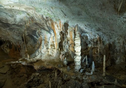 Stalactites and stalagmites underground in cave system in Postojna