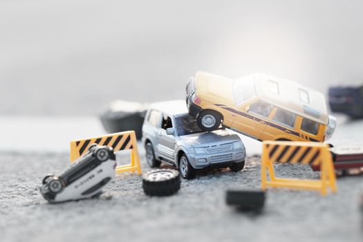 Scene of cars (miniature, toy model ) accident on street.Insurance  concept.