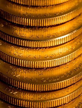 Stack of golden coins using US Treasury issue Gold Eagle one ounce pure gold coin