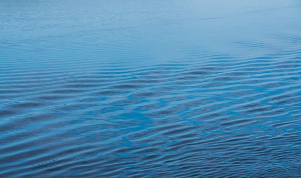 Ripples in the calm Adriatic sea off the coast of Croatia as ship approaches port of Zadar