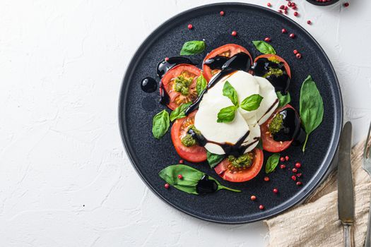 Caprese salad with cherry kumato tomatoes with black pepper. Close up. top view space for text