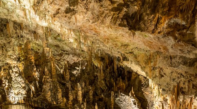 Stalactites and stalagmites underground in cave system in Postojna