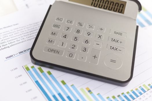 Business analysis - Checking accounting report on business table with calculator