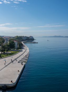 Early morning calm along the promenande by the port of Zadar in Croatia