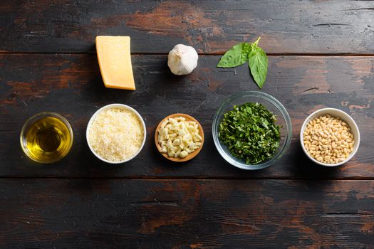 italian food background, healthy food concept or ingredients for cooking pesto sauce on a vintage wood background, top view with copy space.