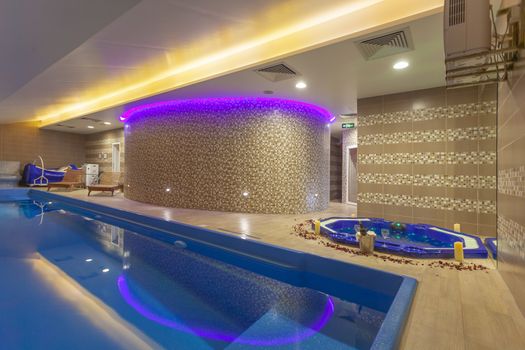 Attractive Indoor Pool and Tub in Modern Luxuty Spa Center