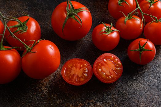 Fresh cherry tomatoes on a metal rustic old background .