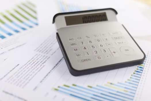 Business analysis - Checking accounting report on business table with calculator