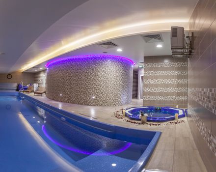 Attractive Indoor Pool and Tub in Modern Luxuty Spa Center