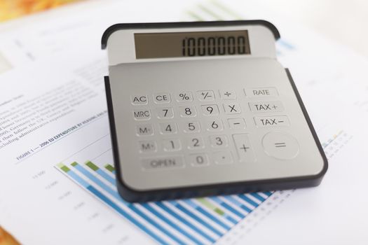 Business analysis - Checking accounting report on business table with calculator