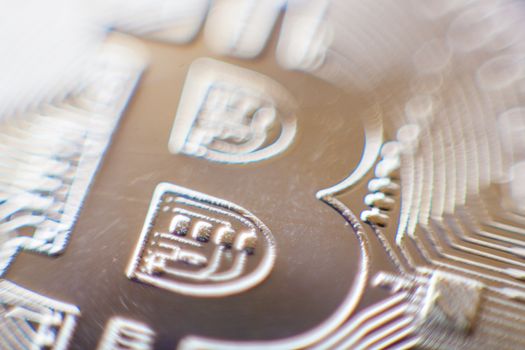 Bitcoin currency coin extreme closeup macro. Gold metal symbol