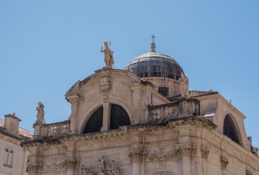 Statues and dome on St Blaise church in the old town of Dubrovnik in Croatia