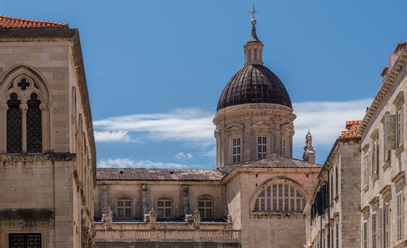 Statues and dome on cathedral church in the old town of Dubrovnik in Croatia