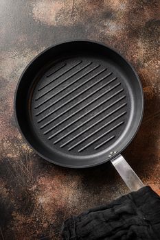 top view of empty grill pans on metal rustic table top view .