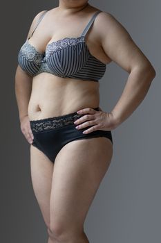 Woman Real Body Plus size Model in lingerie posign, imperfect nonideal