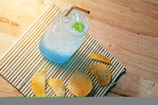 Blue ice tea art coffee on wooden texture table