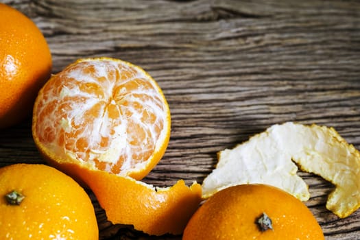 Mandarin orange on wood background with copy space