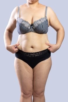 Woman Real Body Plus size Model in lingerie posign, imperfect nonideal