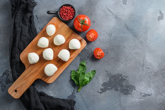 Mozzarella cheese, basil tomato cherry balsamic black slate stone Ingredients space for text.