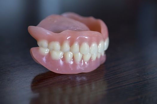 The artificial medical denture set on black background