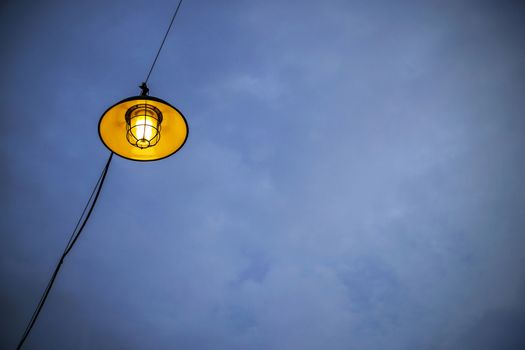 Lamp on blue sky at twilight