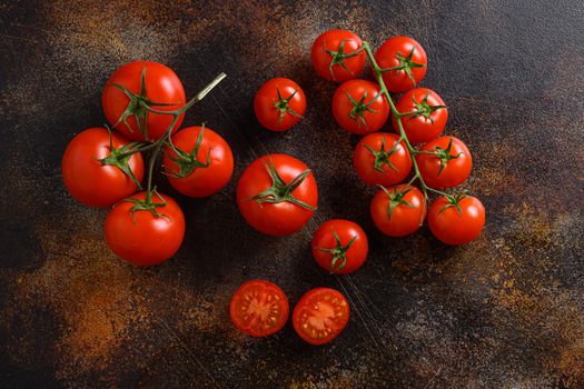 Fresh cherry tomatoes on a metal rustic old background space for text