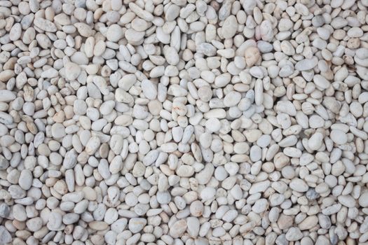White pebbles textured abstract background, stock photo