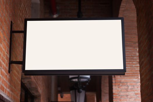 White regtangle signboard on the brick wall, stock photo