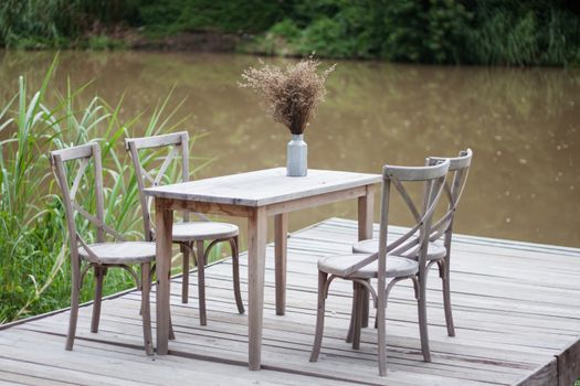 Wooden tables outside coffee shop, stock photo