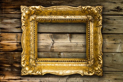 Big Old Gold Picture Frame on wooden background