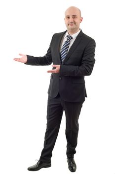 Handsome businessman with arm out in a welcoming gesture, isolated on white