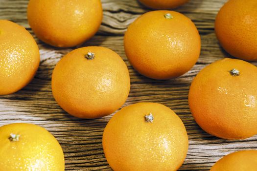 Mandarin orange on wood background