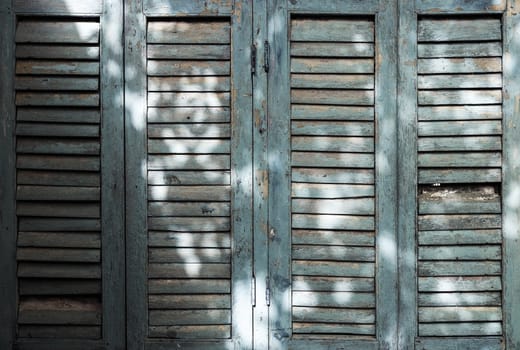 Old wooden window with sunlight texture background