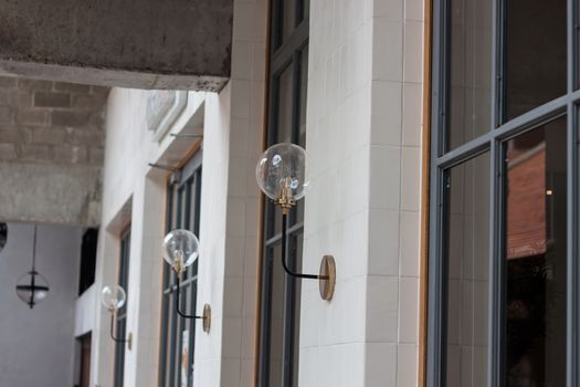 Metal lighting lamp on the wall, stock photo