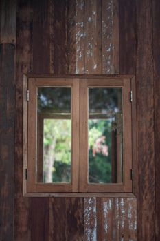 Wooden window frame on backyard, stock photo