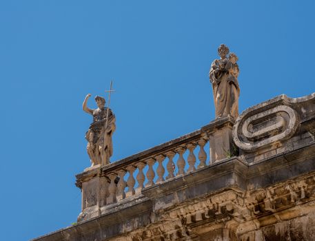 Statues above the entrance to cathedral church in the old town of Dubrovnik in Croatia
