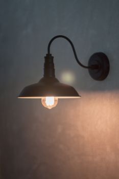 Metal lighting lamp on the wall, stock photo