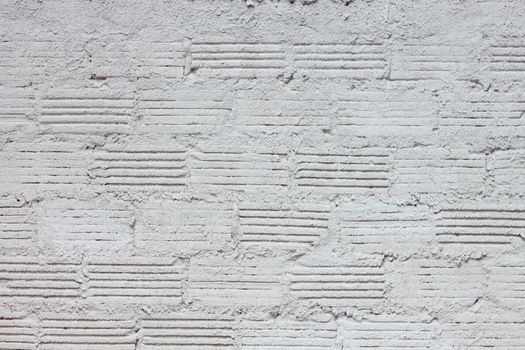 Abstract weathered textured white brick wall background, stock photo