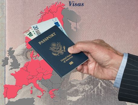 Senior man holding US passport and Euros on map of European Union in preparation for ETIAS visa
