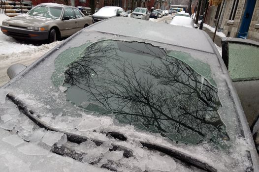 Thick layer of ice covering car after freezing rain in Montreal, Canada