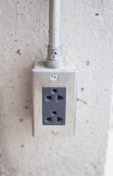 Power socket on concrete wall, stock photo